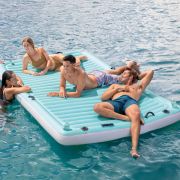 People floating on the Intex Floating Water Lounge Mat