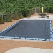 Lifestyle image of Hi-Tech Micro-Mesh Cover on an inground rectangular pool